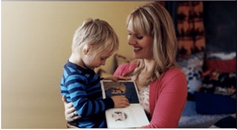 Mother holding special needs son. Women finding joy in her son.